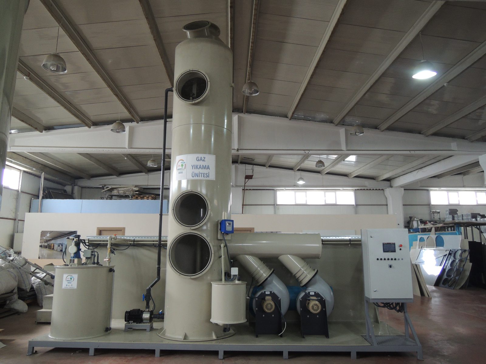 GESU complete gas washing unit — tower, twin fans, chemical tank and control panel on a single frame