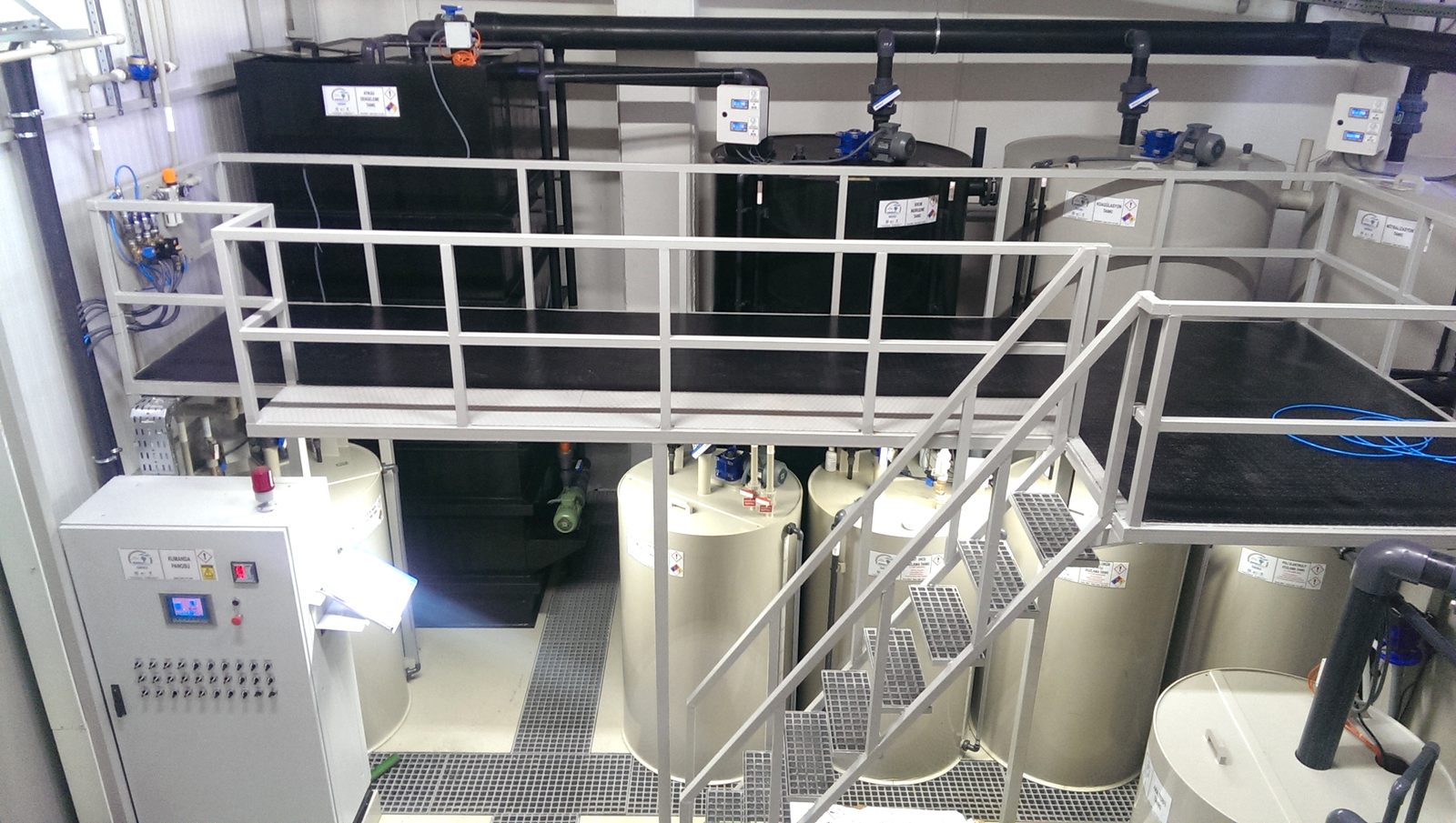 Maysan Mando chemical wastewater treatment unit — process and dosing tanks, service platform, control panel