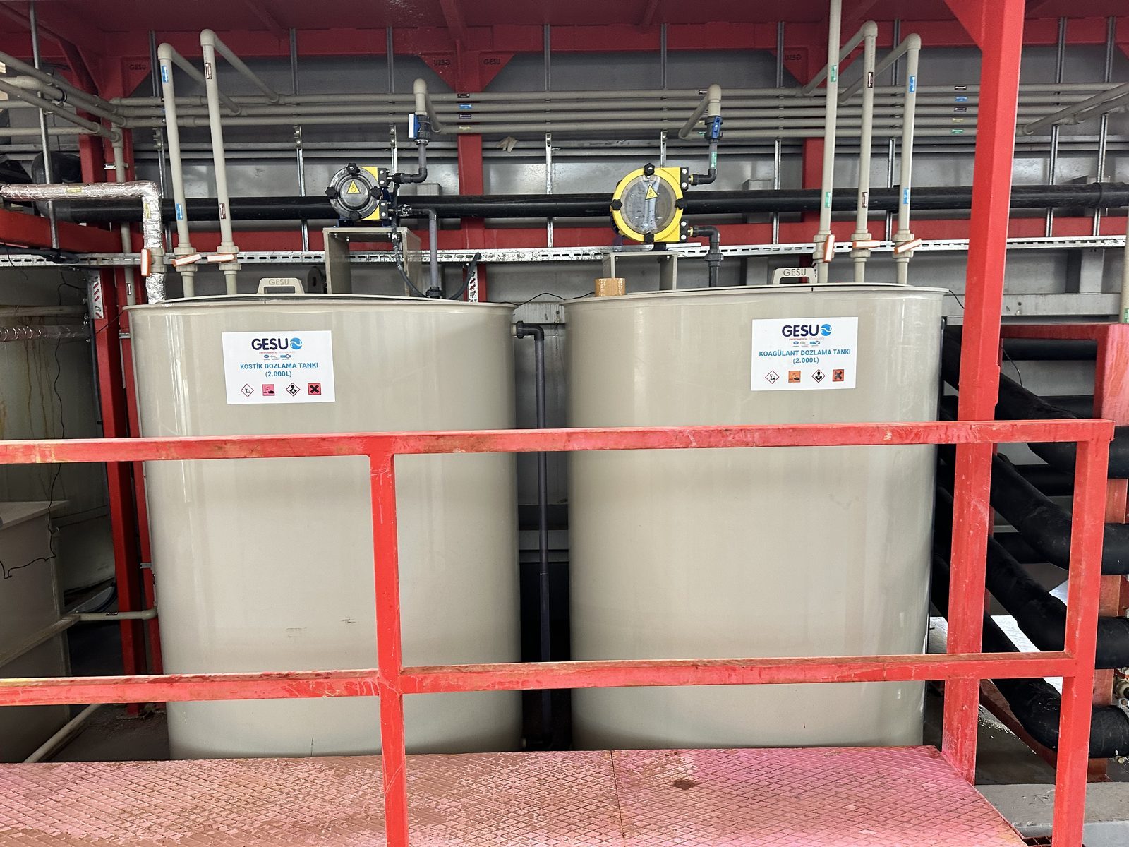 GESU-labelled caustic and coagulant dosing tanks — plating plant chemical treatment