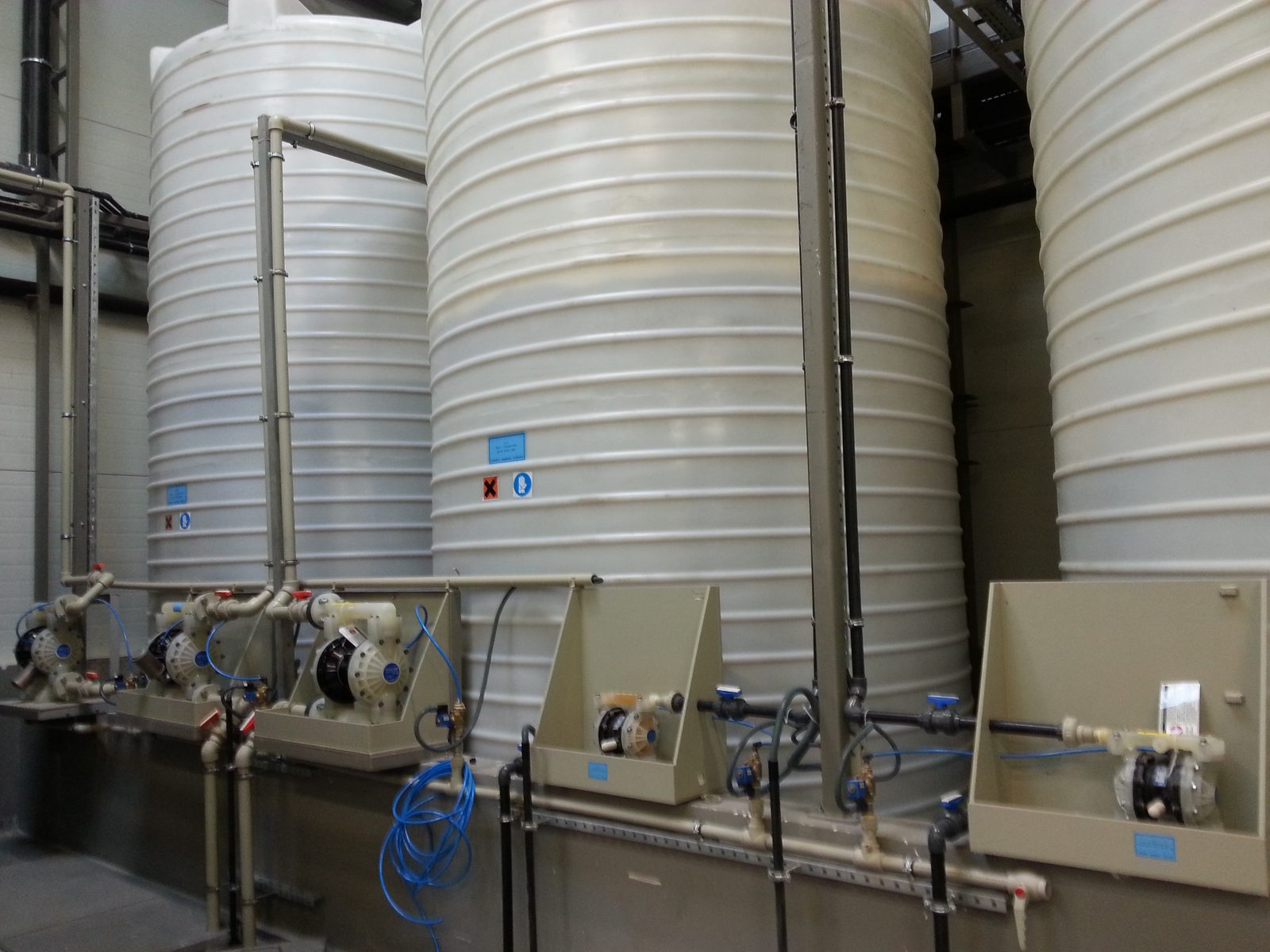 Chemical storage tanks with diaphragm-pump dosing stations in front