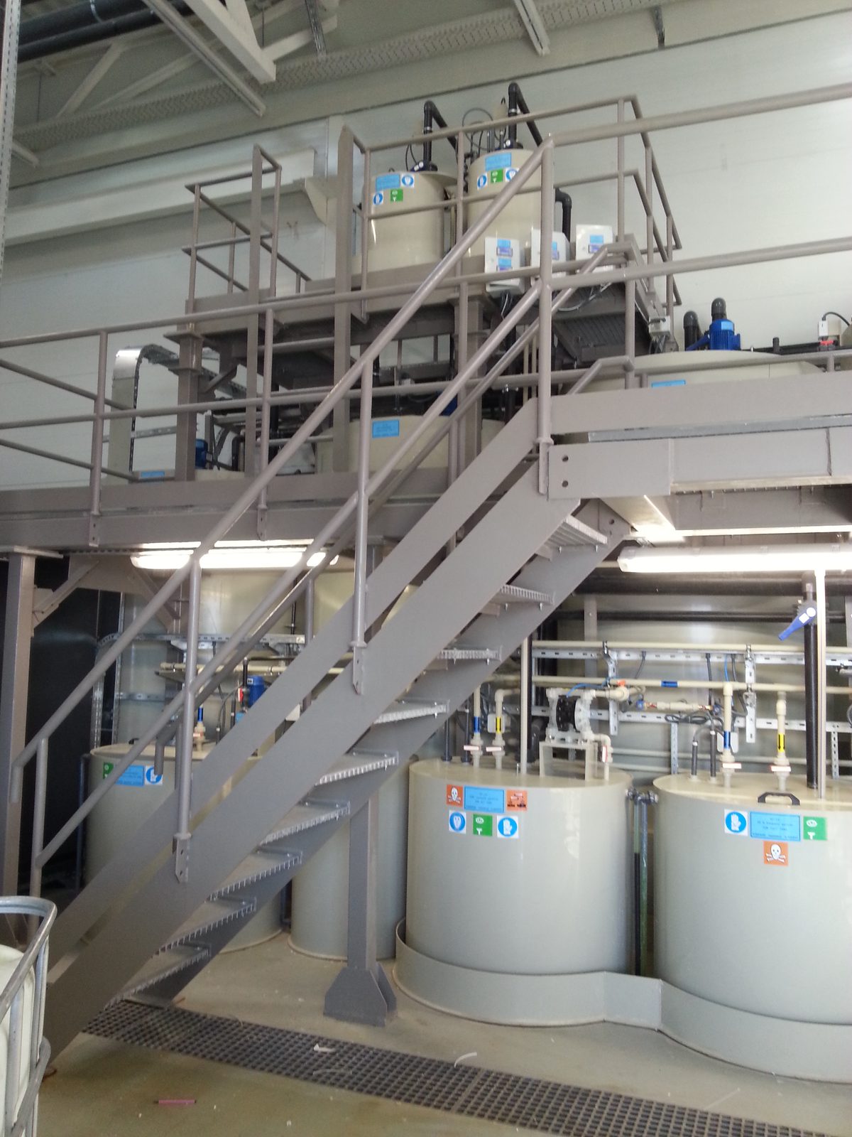 Steel service platform and stair; PP tanks and pipework below, dosing tanks above